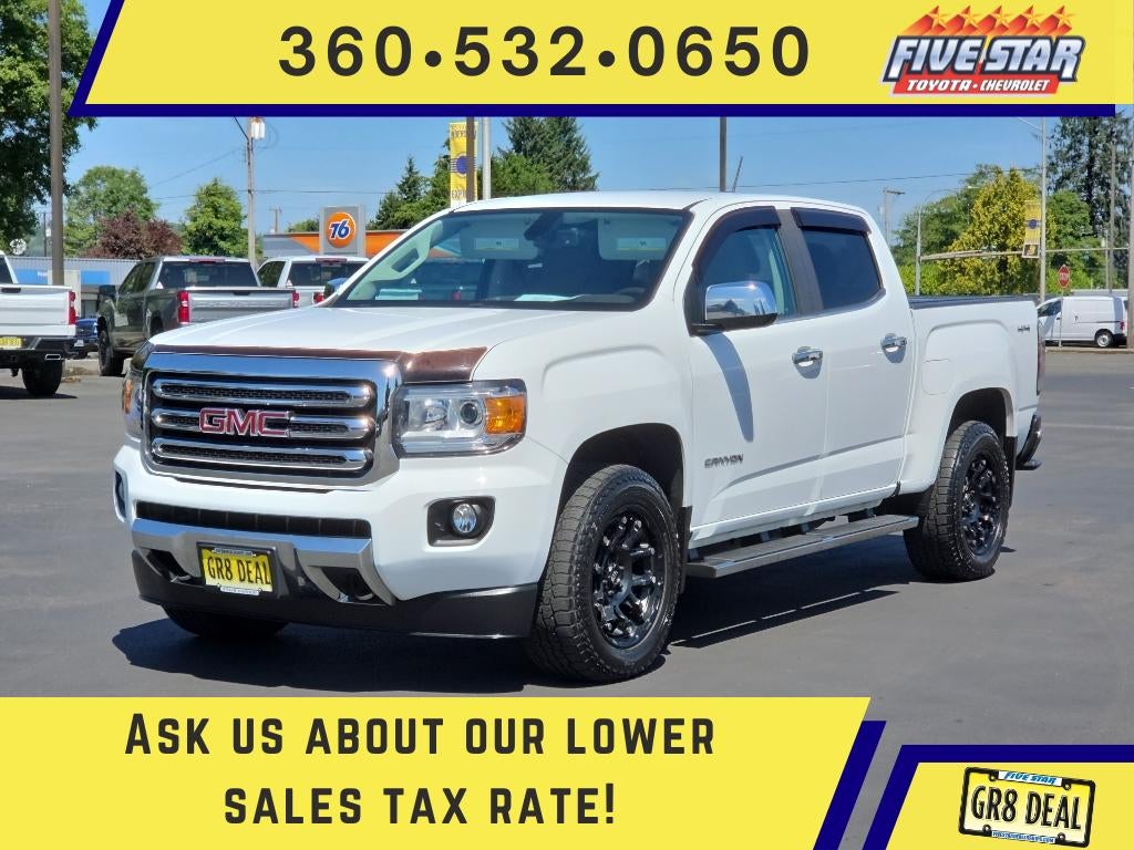 2017 GMC Canyon 4WD SLT in Summit White — front three-quarter view