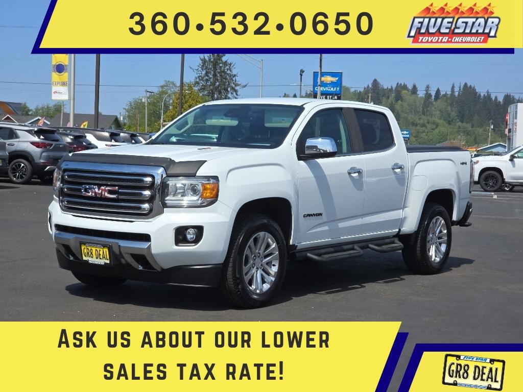 2018 GMC Canyon 4WD SLT in Summit White — front three-quarter view
