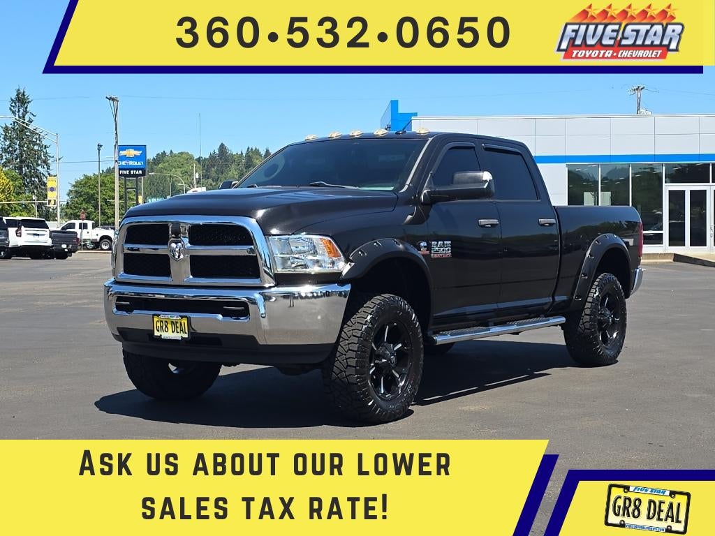 2016 RAM 2500 Tradesman in Brilliant Black Crystal Pearlcoat — front three-quarter view