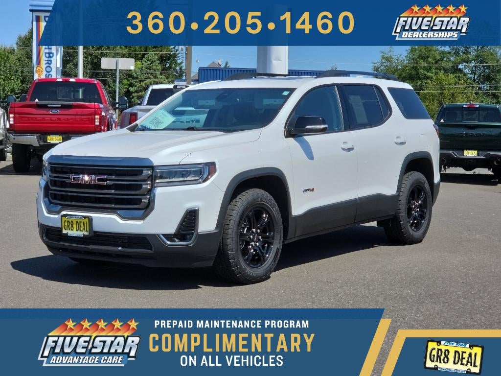 2023 GMC Acadia AT4 in White Frost Tricoat — front three-quarter view