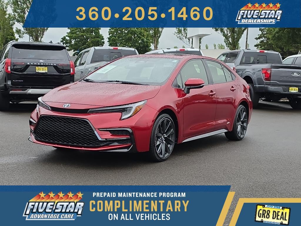 2023 Toyota Corolla Hybrid Hybrid SE in Ruby Flare Pearl — front three-quarter view